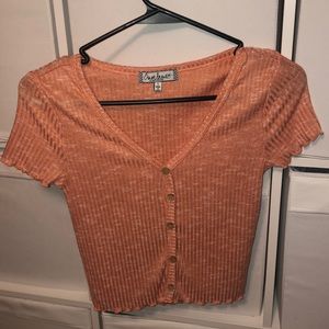 orange button down top